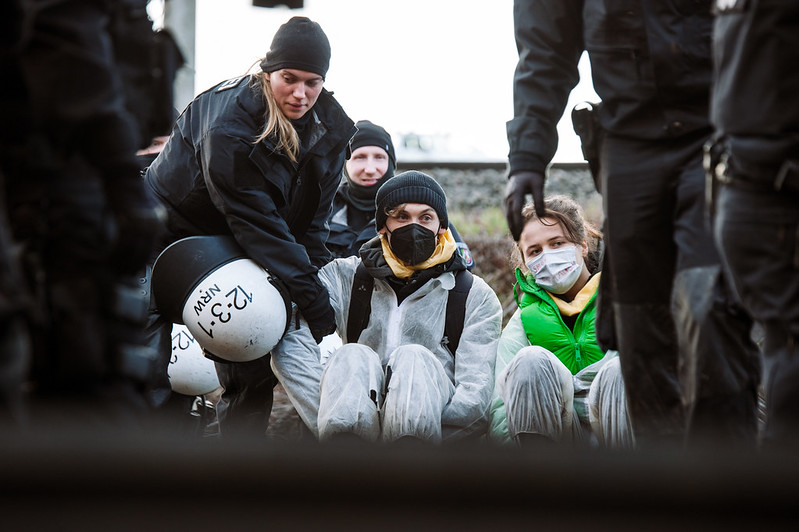 Activists are cleared from their sit-in by cops. 